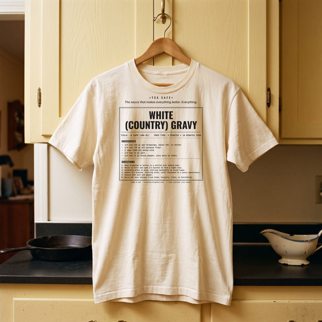 White Country Gravy recipe shirt on a hanger in a vintage kitchen