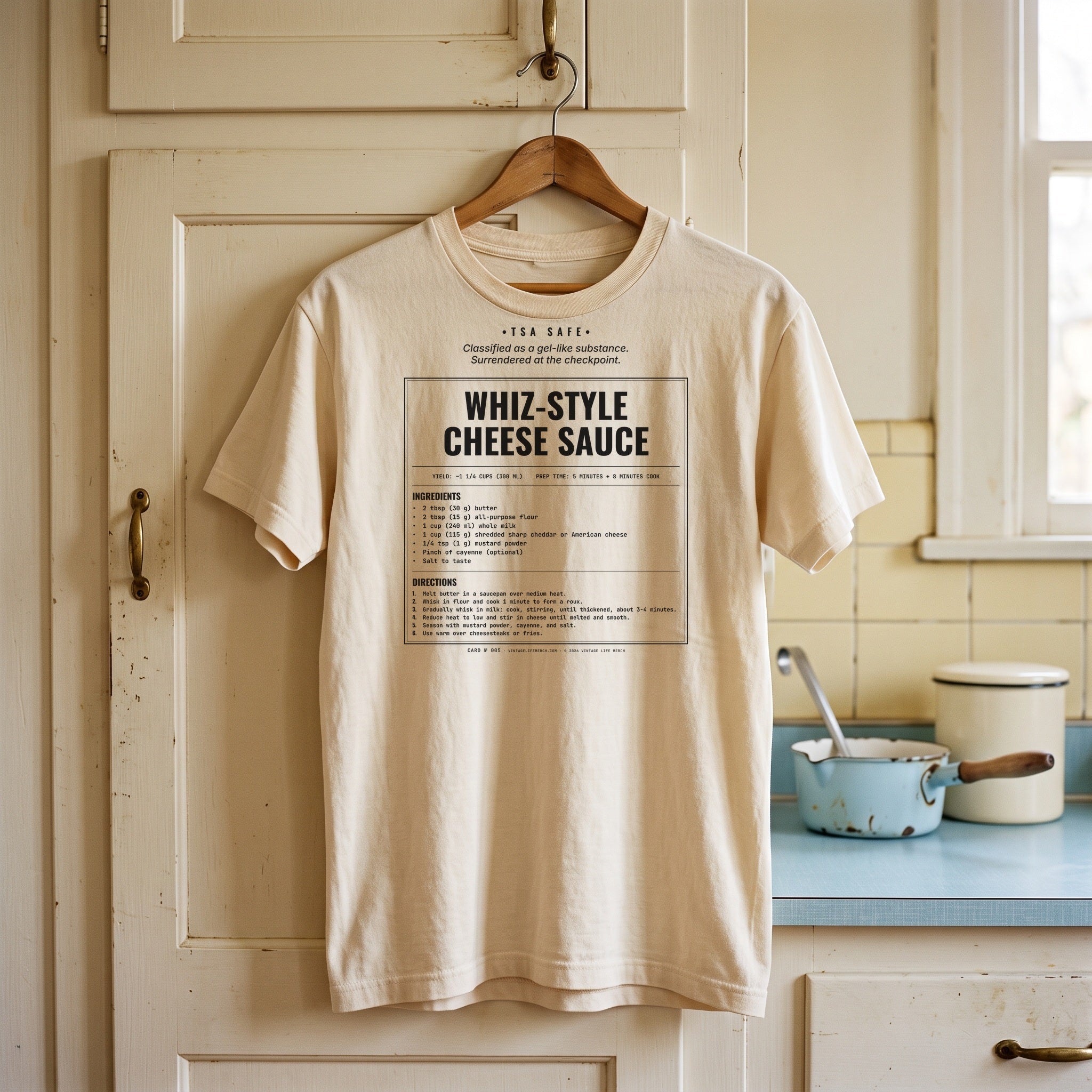 Whiz-Style Cheese Sauce recipe shirt on a hanger in a vintage kitchen